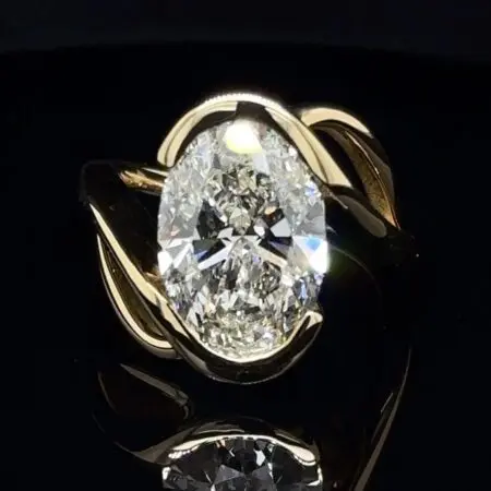5-carat oval diamond in a yellow gold bypass setting