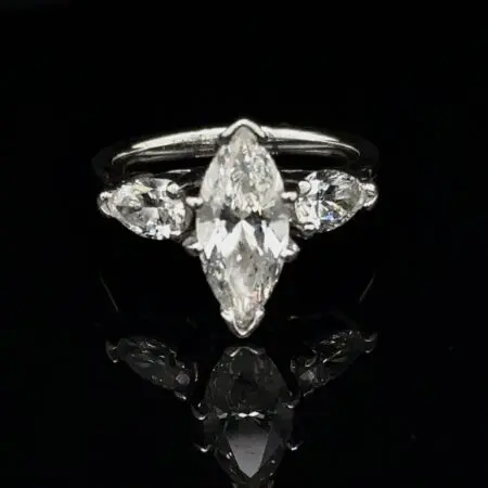 Marquise diamond ring with pear-shaped side diamonds in white gold