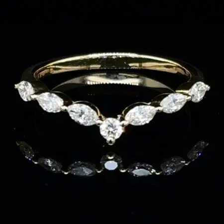 Chevron band of marquise diamonds with a round center diamond in yellow gold