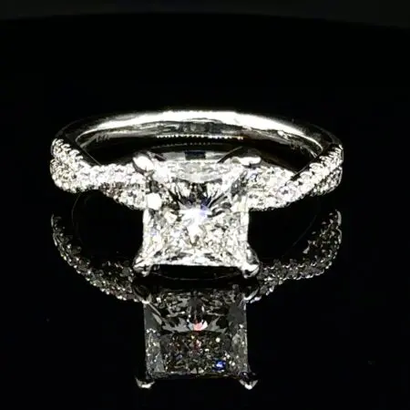 Princess-cut diamond engagement ring with a twisted pavé white gold band
