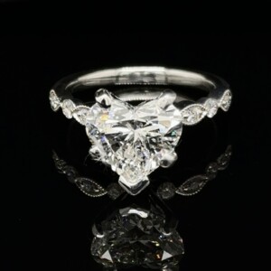 2-carat heart-shaped diamond engagement ring with marquise-pattern accents on a white gold band