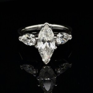 Marquise diamond ring with pear-shaped side diamonds in white gold