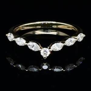 Chevron band of marquise diamonds with a round center diamond in yellow gold